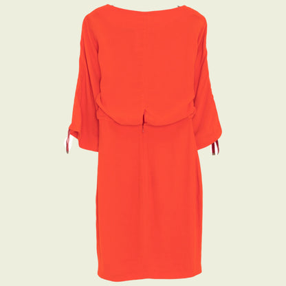 Red dress on a beige background