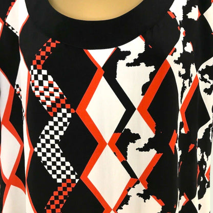 Close-up of a black, white, and red patterned fabric
