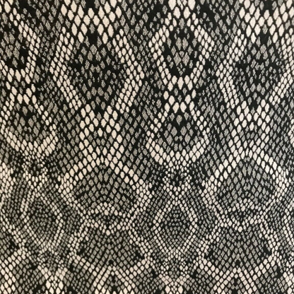 Patterned fabric with black and beige snake skin design
