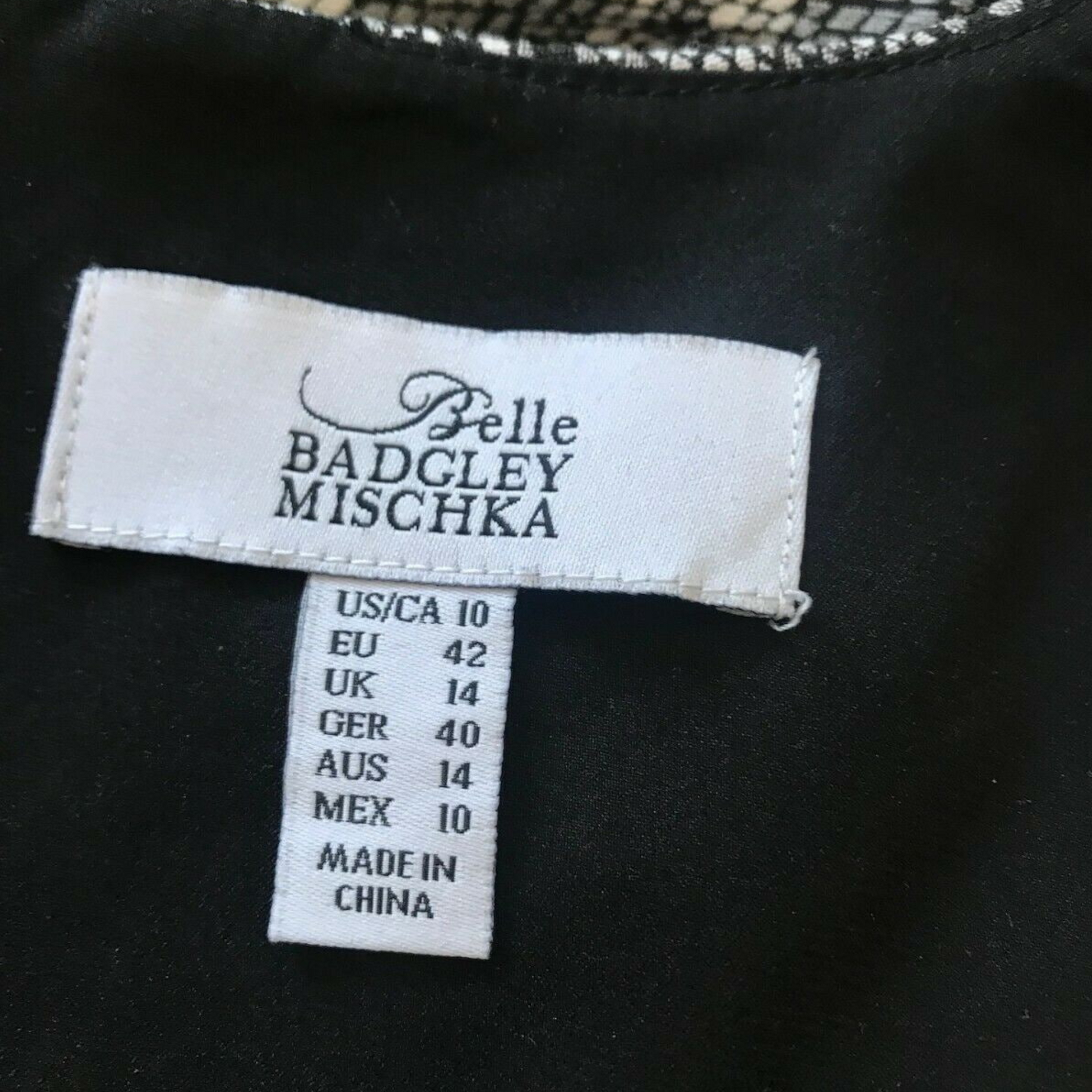 Belle Badgley Mischka label on a garment with size information.