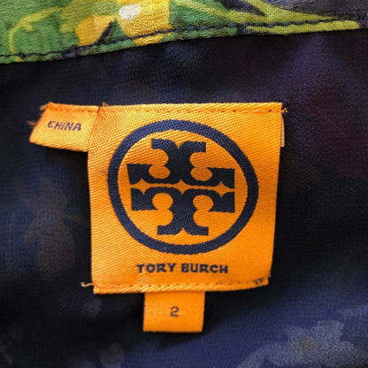 Tory Burch label on a garment with floral pattern