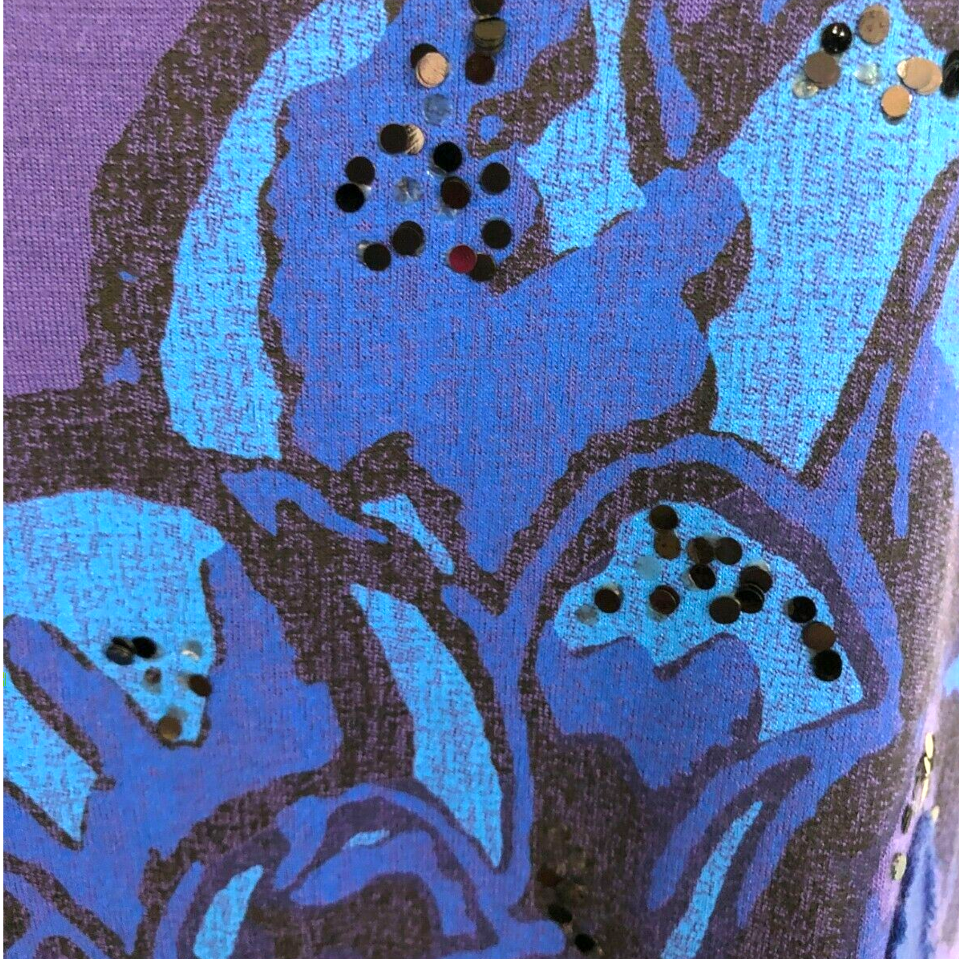 Abstract art with blue and black shapes on a textured surface