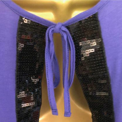Purple top with black sequin panels and a tie on a gold background