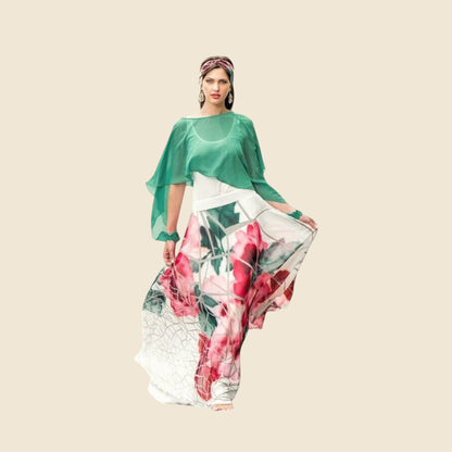 Woman wearing a green top and floral pants on a beige background