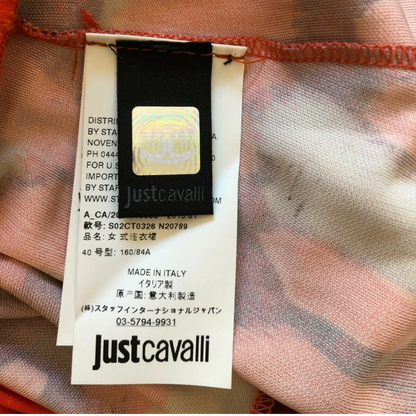 Clothing label showing JUST CAVALLI on cream background