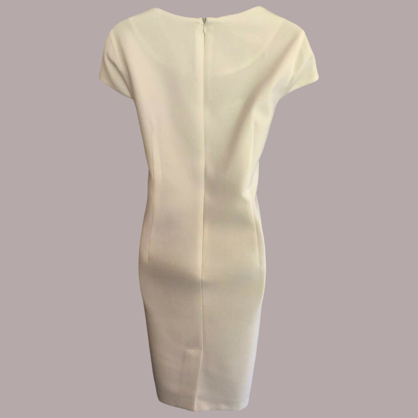 Back of pencil dress on taupe background