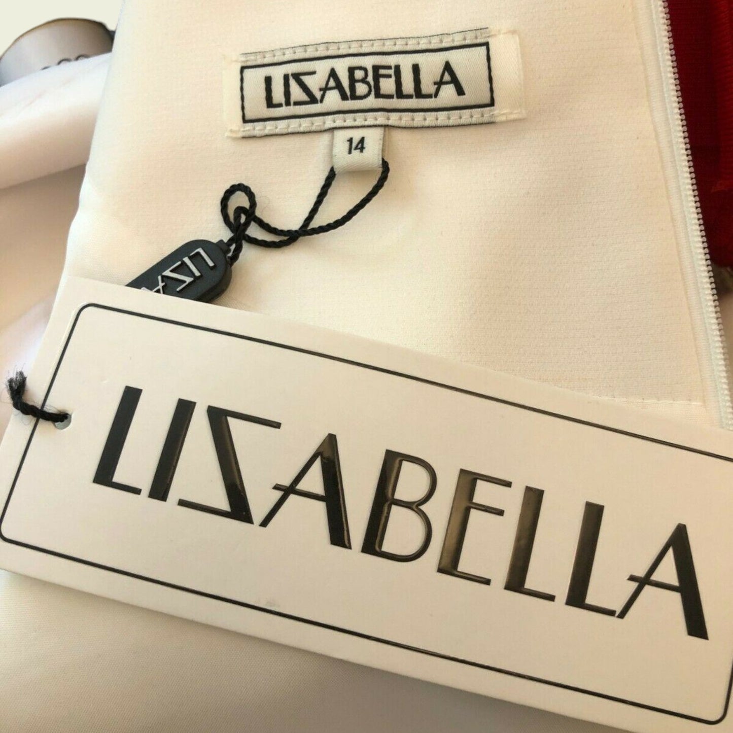Clothing label showing LIZABELLA and size on white background