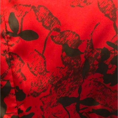 Red fabric with black floral pattern