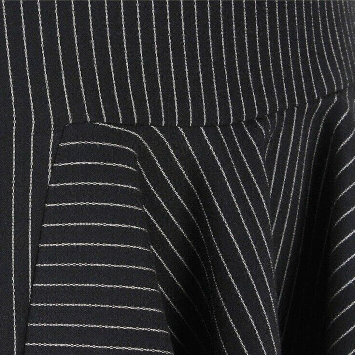 Close-up of a black pinstripe skirt