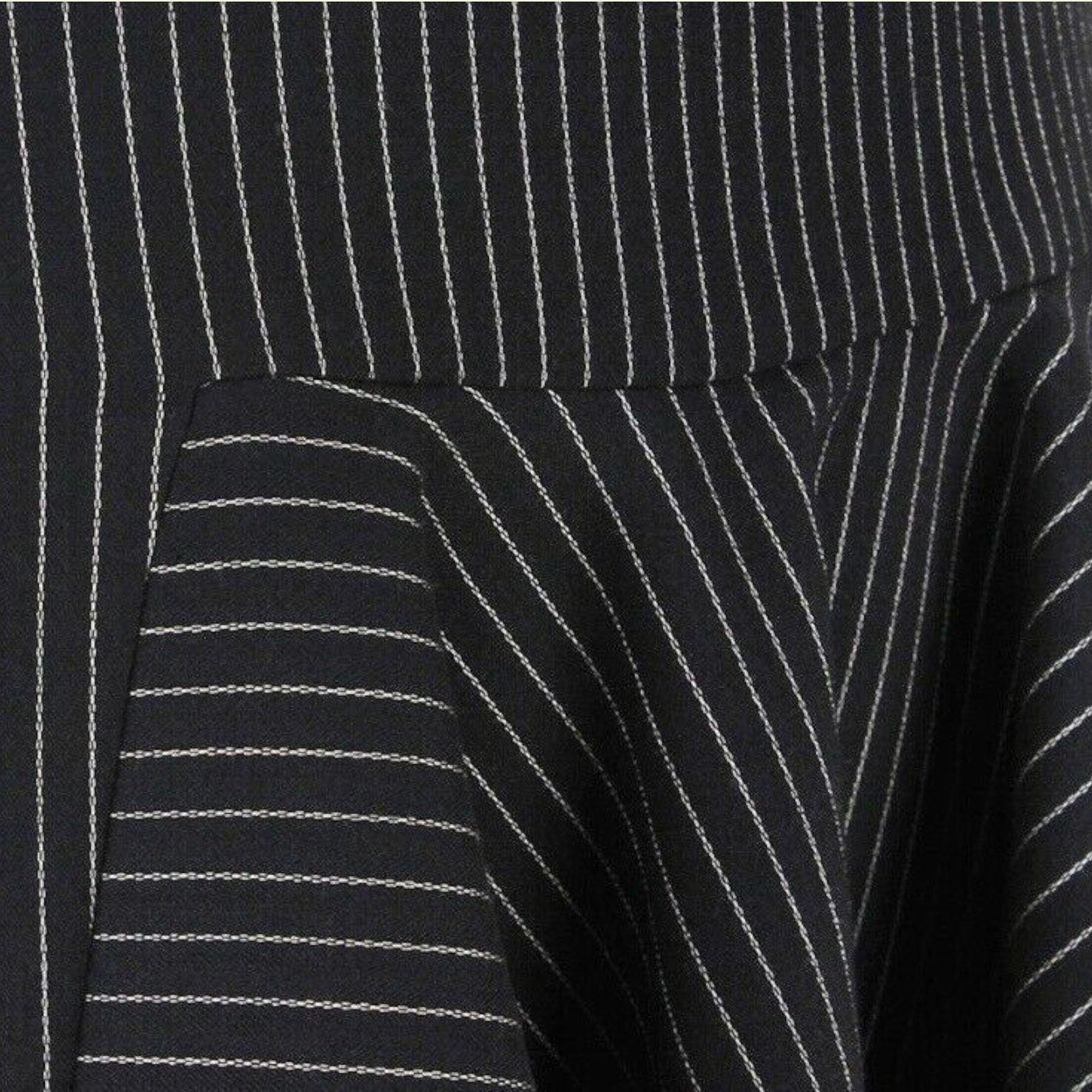 Close-up of a black pinstripe skirt