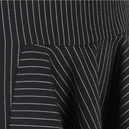 Close-up of a black pinstripe skirt