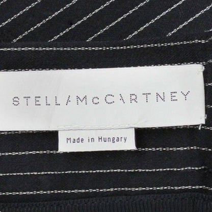 Stella McCartney label on black fabric with white stitching