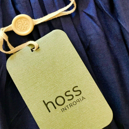 Garment label showing Hoss on product tag on blue background