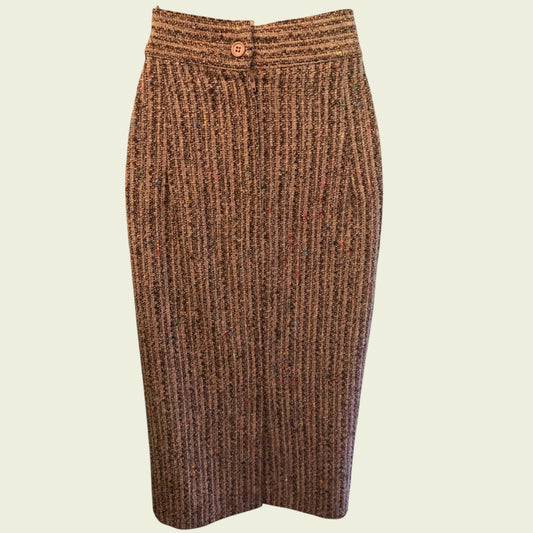 Brown ribbed knit skirt on a beige background