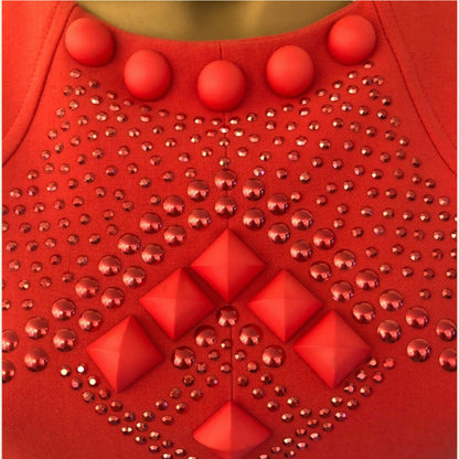 Red fabric with red buttons and studs