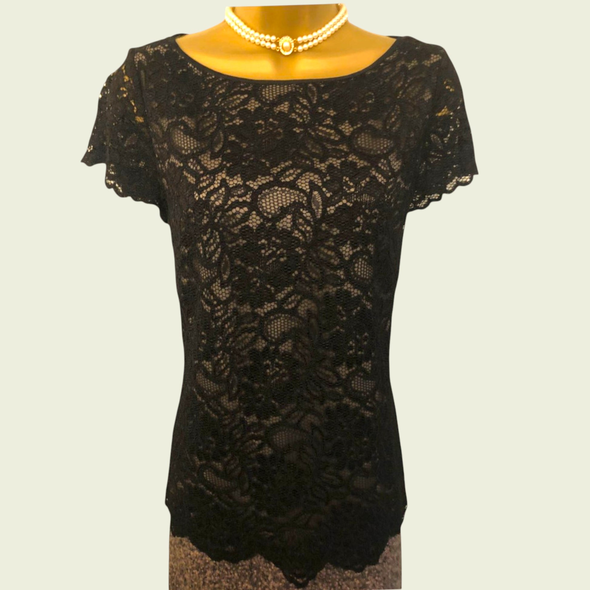 Black lace dress on a plain background