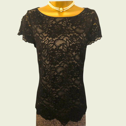 Black lace dress on a plain background