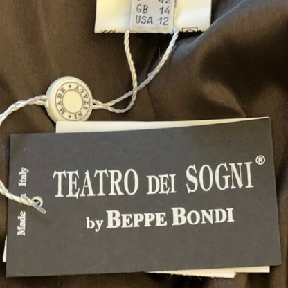 Clothing label with Teatro Dei Sogni and size details on a beige background