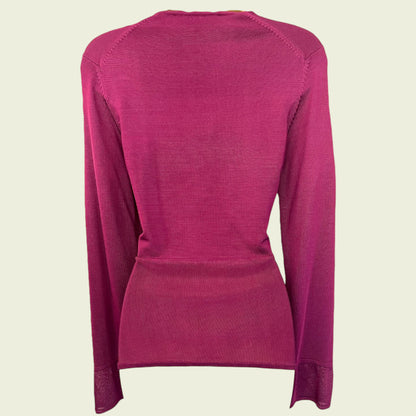 Fuchsia Pink long-sleeve shirt on a beige background