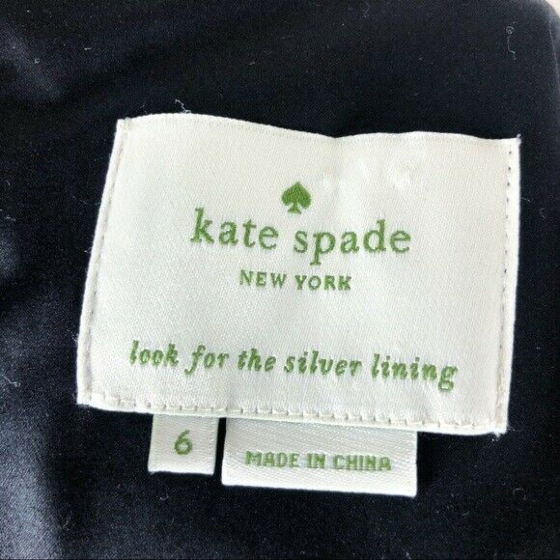 Kate Spade New York label on a garment with 'look for the silver lining' text.