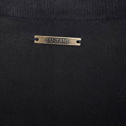 Close-up of a black garment with a 'LIU JEANS' label.