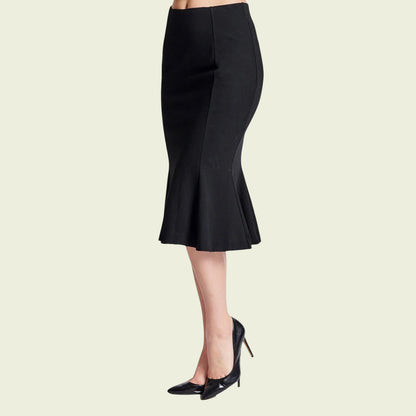 Black pencil skirt worn by a person on a light beige background
