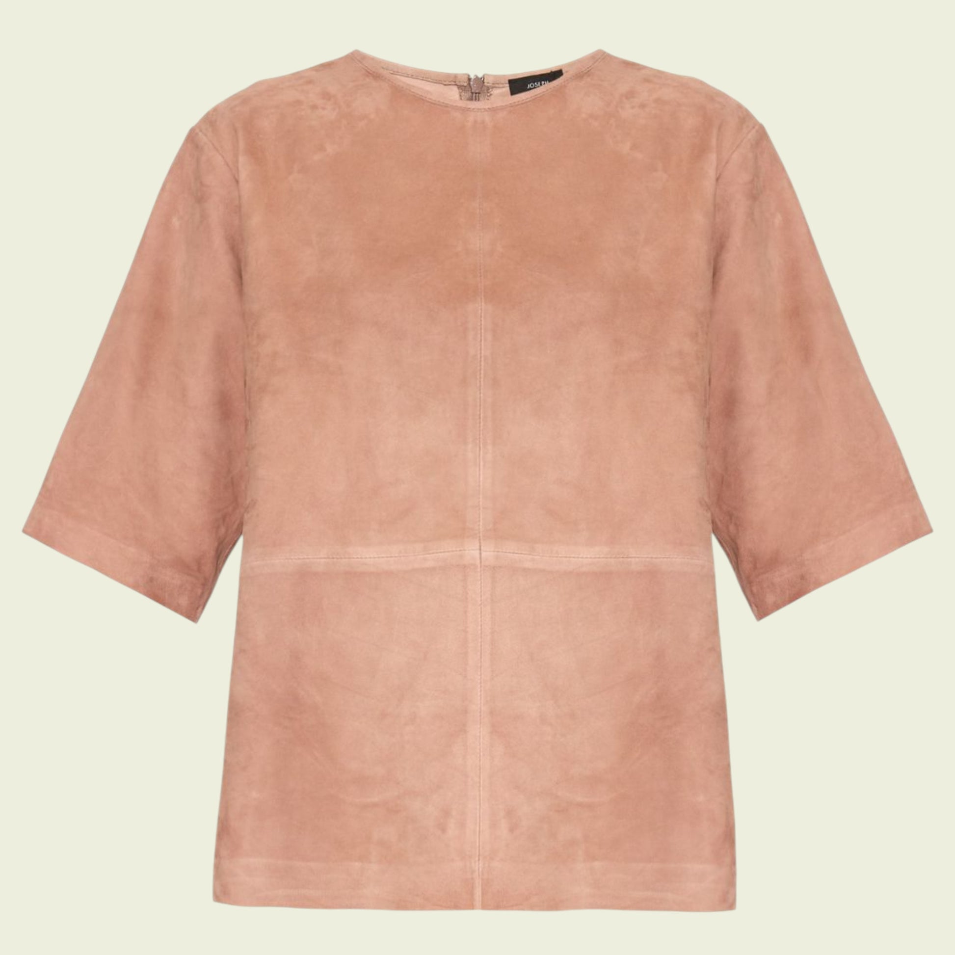 Tan suede top on a beige background