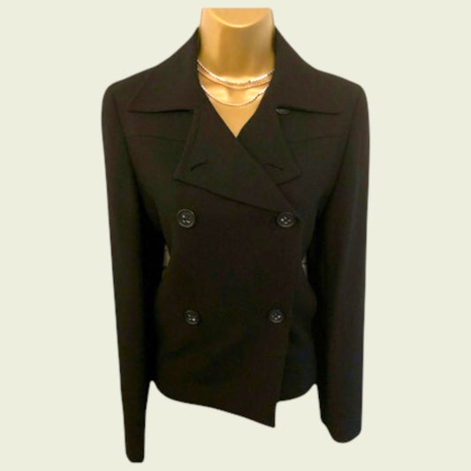 Black peacoat on a mannequin against a plain background