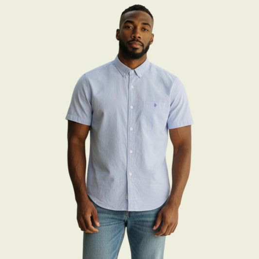 Model wearing lilac shirt on beige background