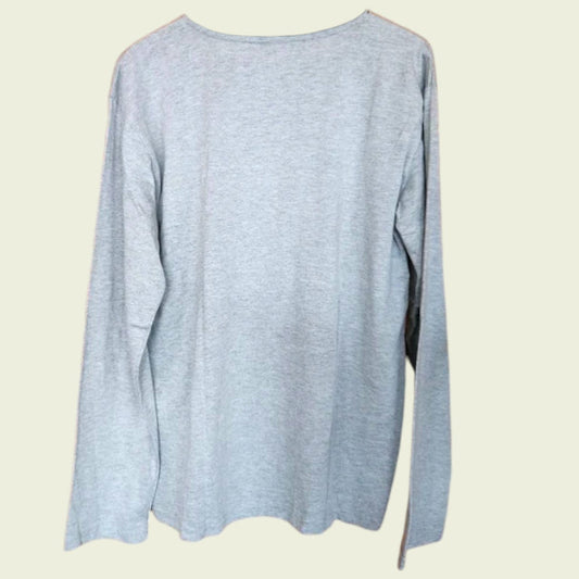 Grey long-sleeve shirt on a beige background