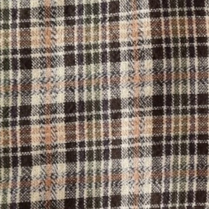 Close-up of a plaid fabric with brown, black, and beige colors.