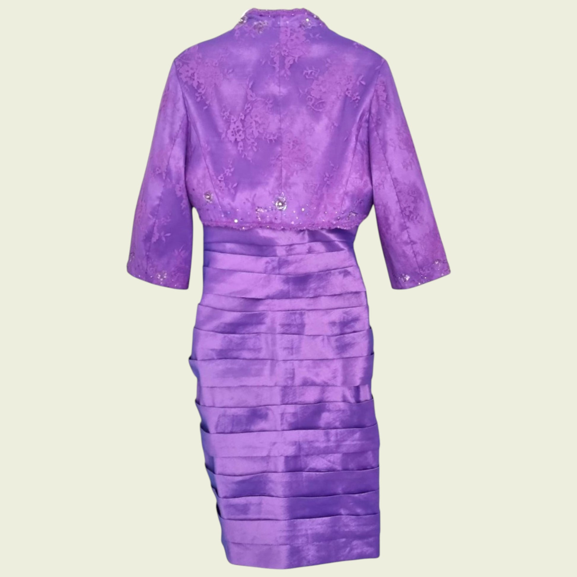 Purple dress with a matching jacket on a beige background