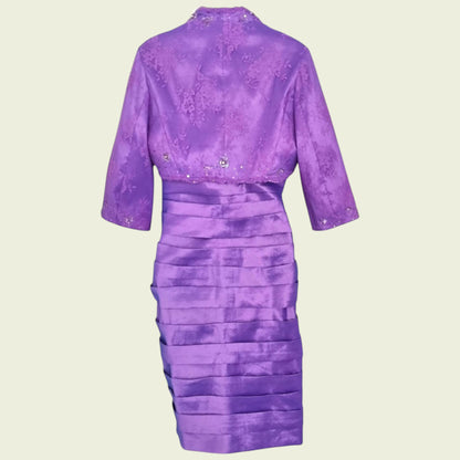 Purple dress with a matching jacket on a beige background