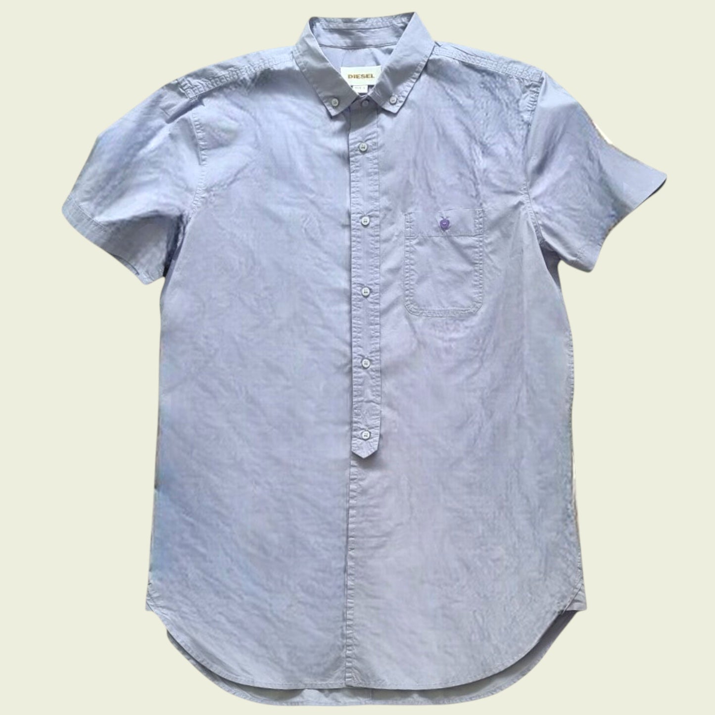 Lilac men's shirt on beige background
