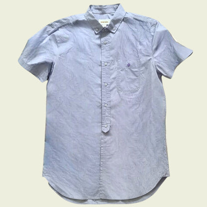 Lilac men's shirt on beige background