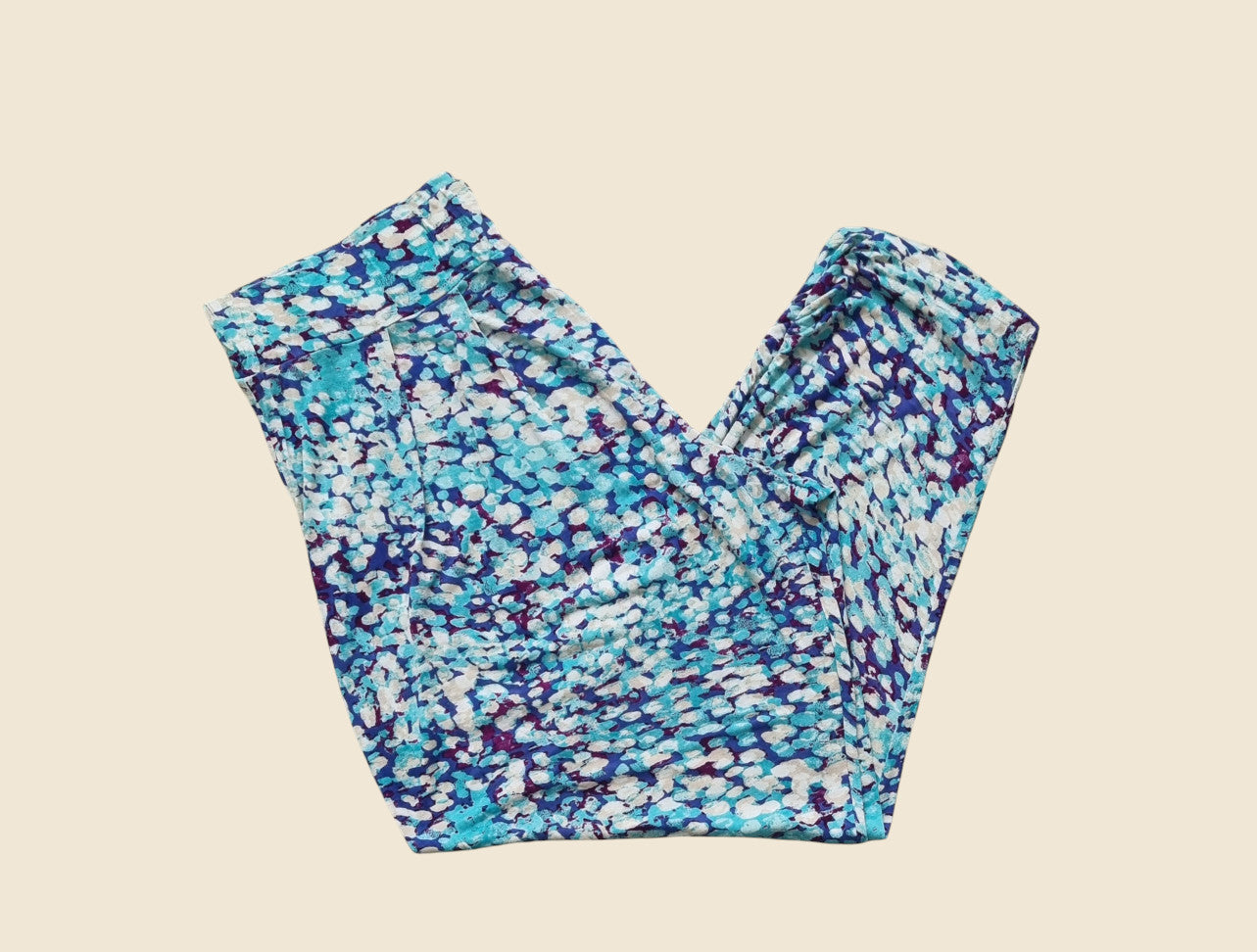 Colorful patterned leggings on a beige background