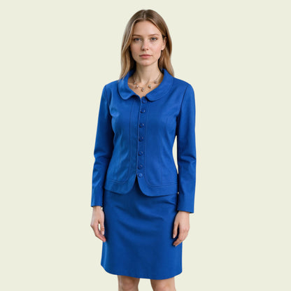 Woman wearing a blue suit on a beige background