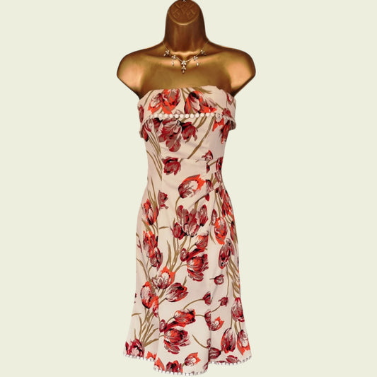 Mannequin wearing a floral bardot top dress on beige background