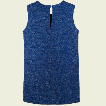 Blue sleeveless dress on a beige background