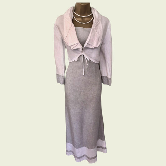 Gray dress with pink jacket on a mannequin against a light green background