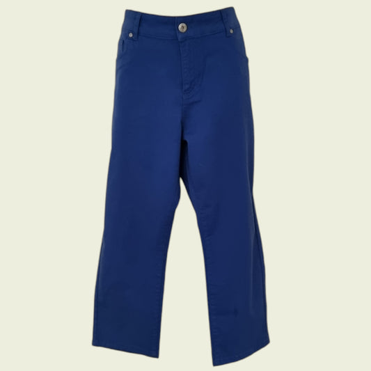 Mid blue jeans on beige background