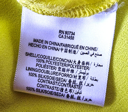 Clothing label with text on a yellow background