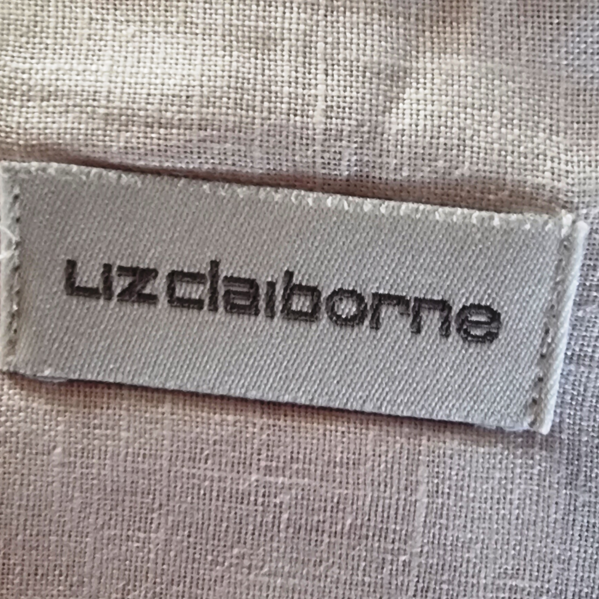 Liz Claiborne label on a textured fabric background