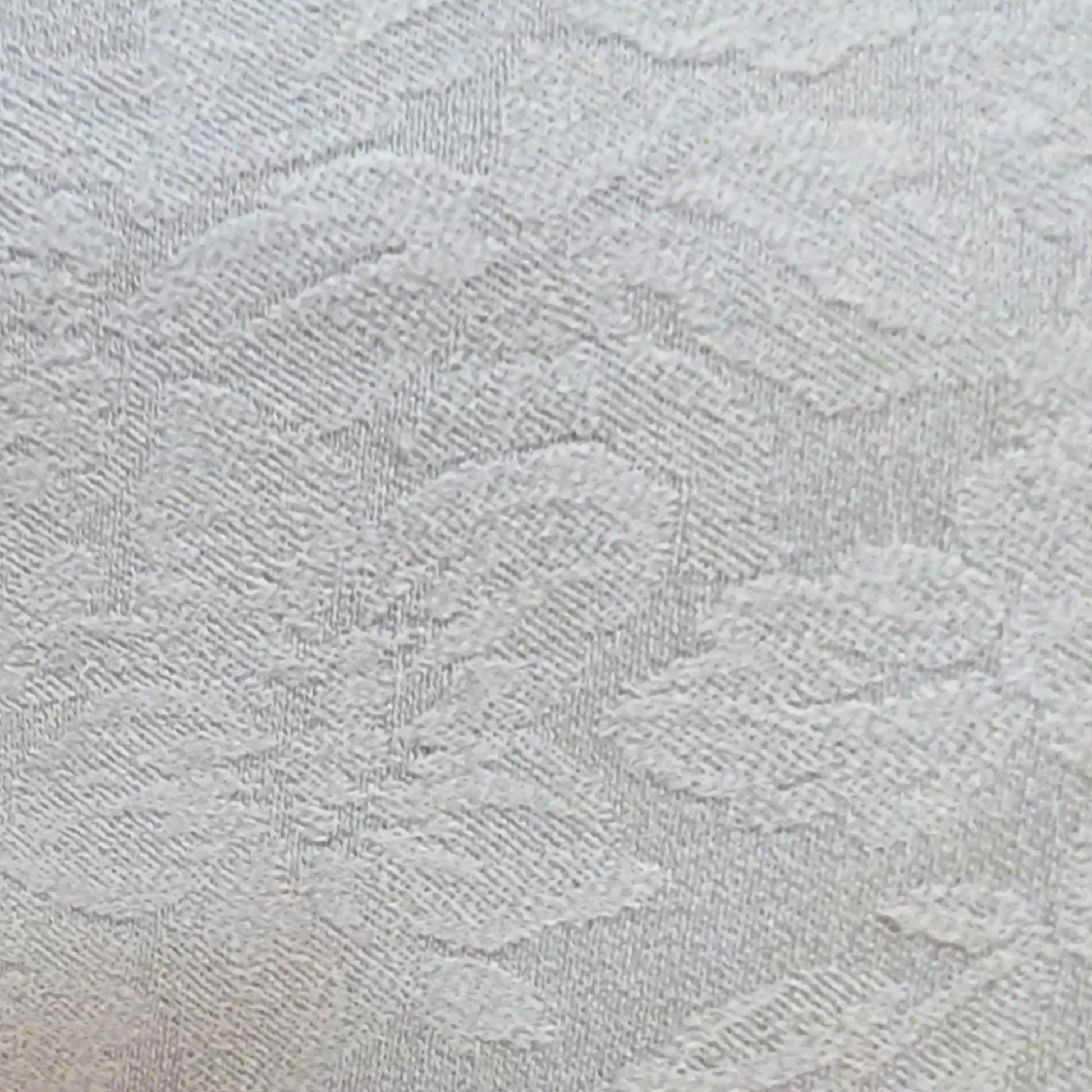 Close-up of textured light gray fabric with a subtle pattern