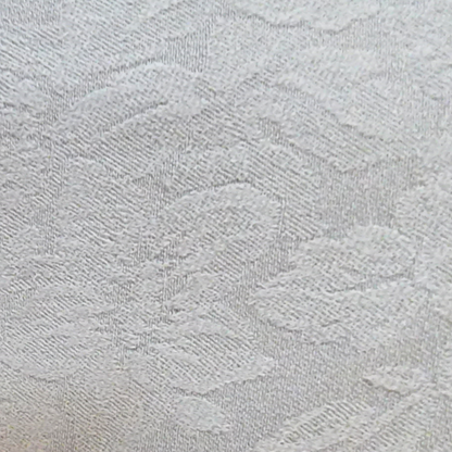 Close-up of textured light gray fabric with a subtle pattern