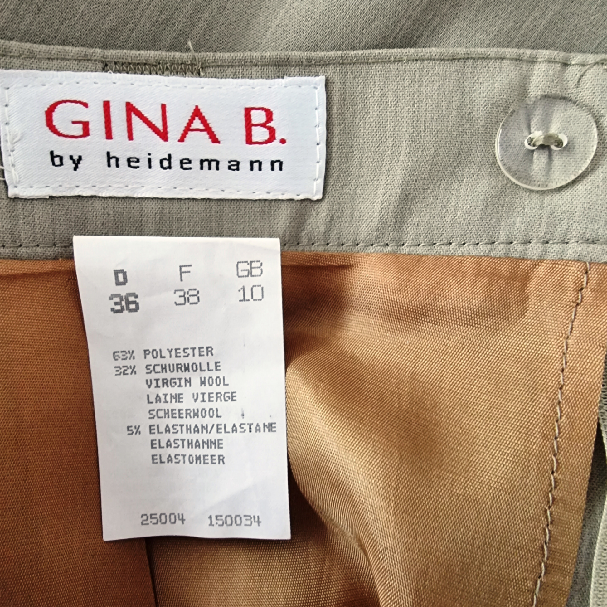 Close-up of a clothing label with 'GINA B. by heidemann' on a garment.