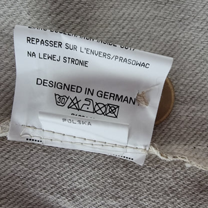 Clothing label with text on a fabric background