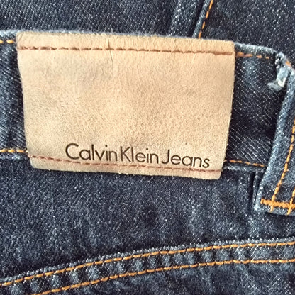 Calvin Klein Jeans label on a denim fabric background