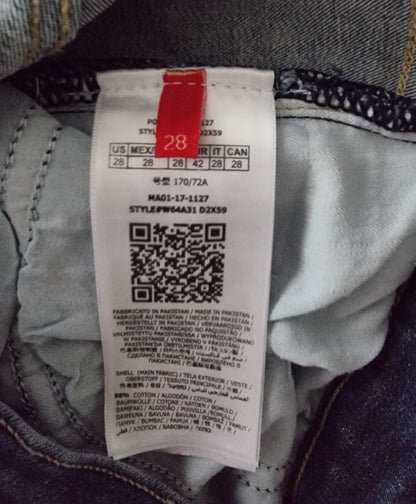 Clothing tag with size label and QR code on a garment