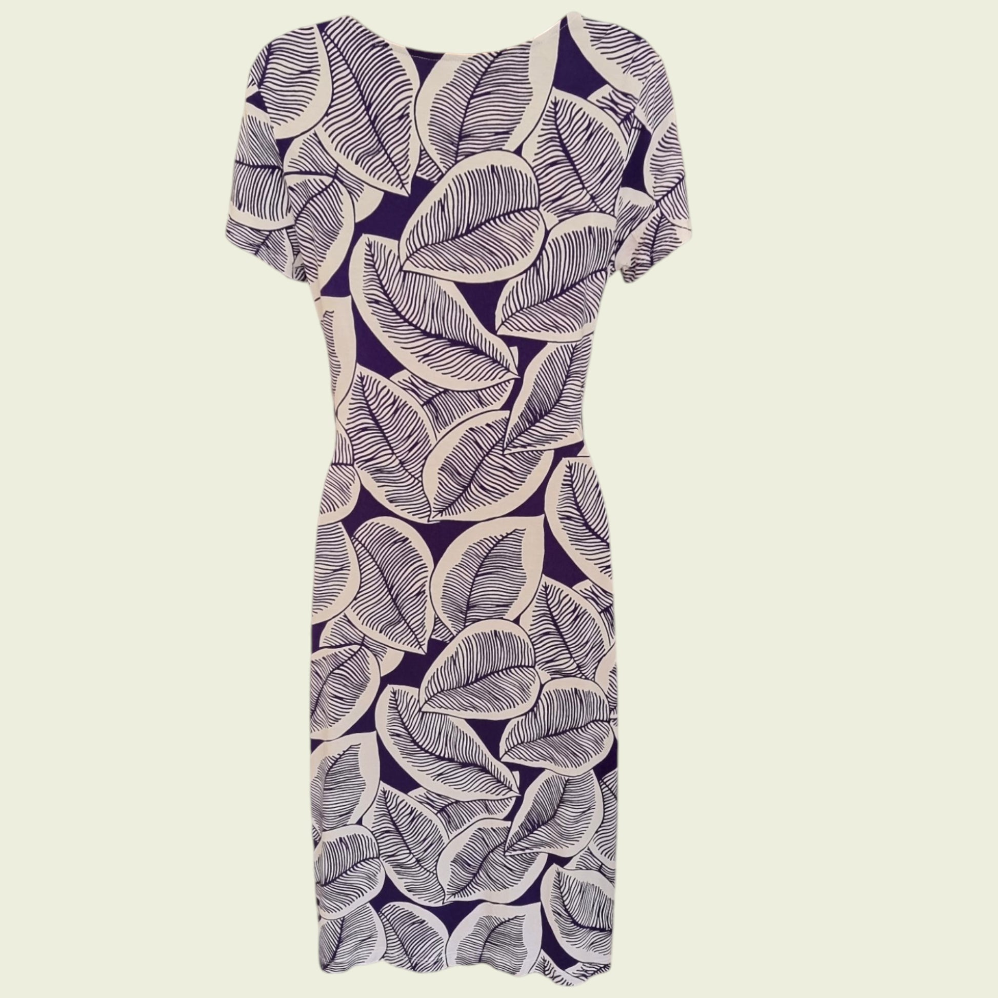 Mannequin wearing a blue and white floral dress on a beige background